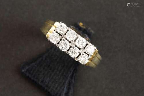 ring in yellow and white gold (18 carat) with at least 0,80 ...