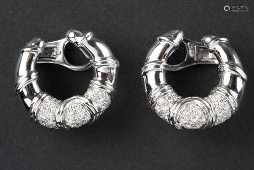 pair of horseshoe shaped earrings in white gold (18 carat) w...