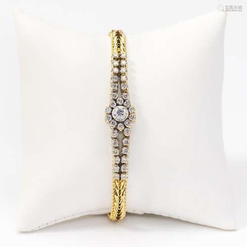 An 14 carat gold and diamond bracelet