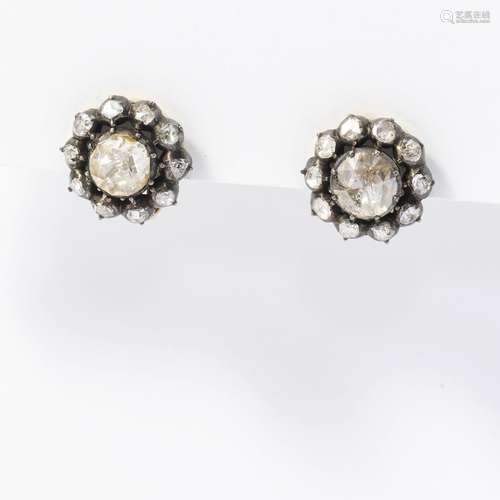 A pair of gold on silver diamond ear clips