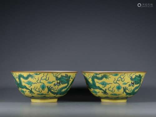 A pair of yellow-ground and green-colored Shuanglong chasing...
