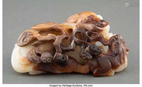 A Chinese Carved Celadon and Russet Jade Fu Lion Figural Gro...