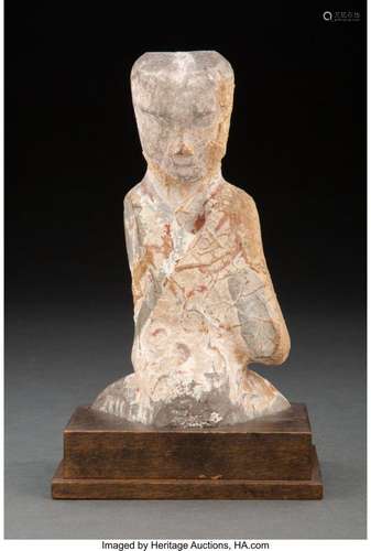 A Chinese Earthenware Kneeling Figure