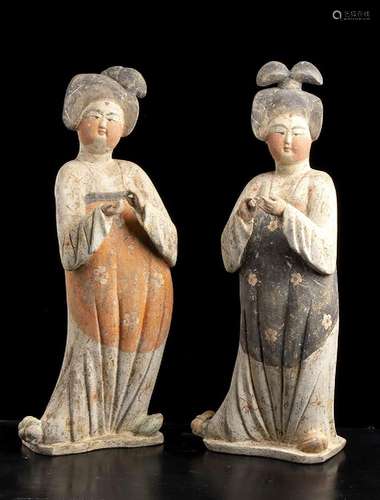 A PAIR OF PAINTED POTTERY FIGURES OF FAT LADIES