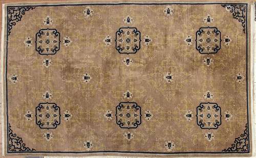 A OCHRE GROUND CARPET WITH FLORAL MOTIFS