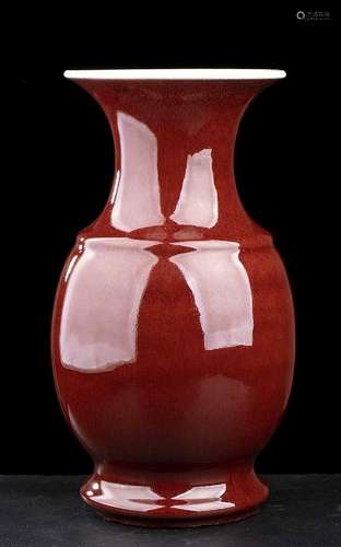 A ‘SANG DE BOEUF’ GLAZED PORCELAIN BALUSTER VASE