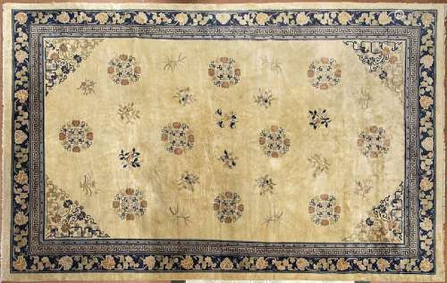 A FINE AND LARGE OCHRE GROUND CARPET WITH POLYCHROME FLORAL ...