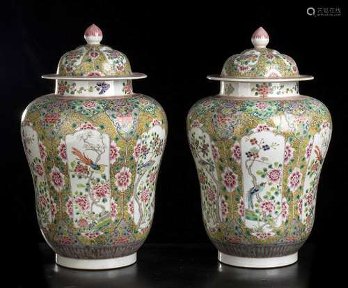 A PAIR OF ‘FAMILLE ROSE’ PORCELAIN VASES AND COVER