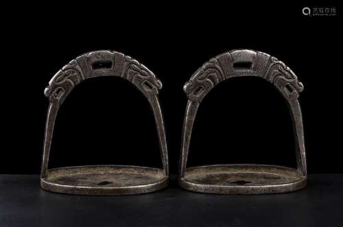 A PAIR OF METAL STIRRUPS