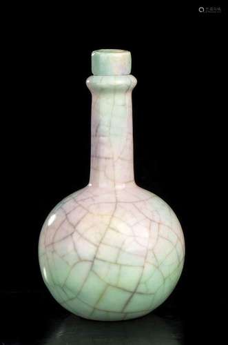 A SMALL GLAZED PORCELAIN BOTTLE