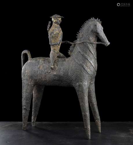 A BRONZE FIGURE ON A HORSE