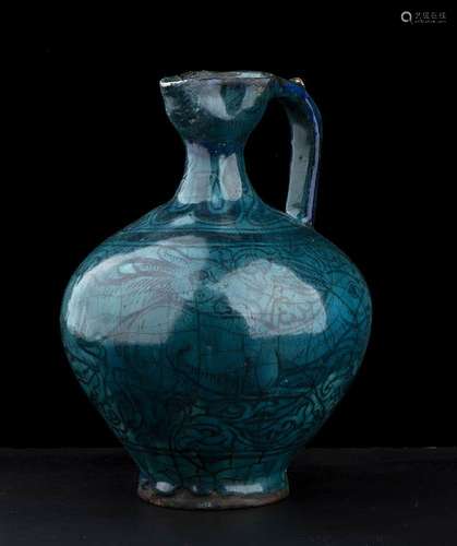 A TURQUOISE GLAZED AND PAINTED CERAMIC EWER