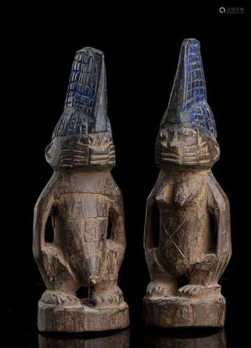 A PAIR OF WOOD ‘IBEJI’ SCULPTURES