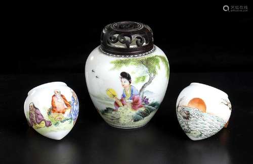 A POLYCHROME ENAMELED PORCELAIN SMALL JAR AND TWO BIRD FEEDE...