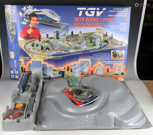 A Mehano train line gauge HO TGV train set with scenic layou...