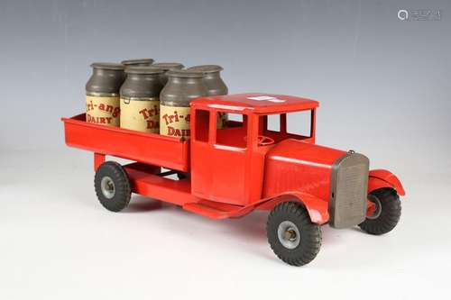 A Tri-ang pressed steel red tipper lorry with six churns