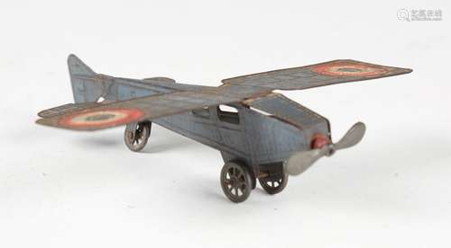 A tinplate model of a high-wing monoplane