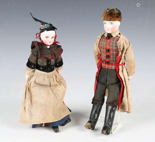 A pair of porcelain head and shoulders dolls