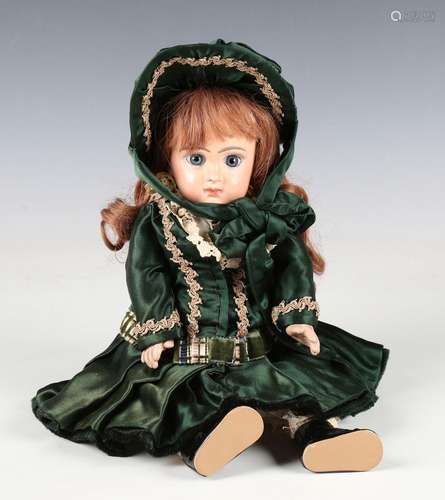 A Tete Jumeau bisque head doll with later brown wig