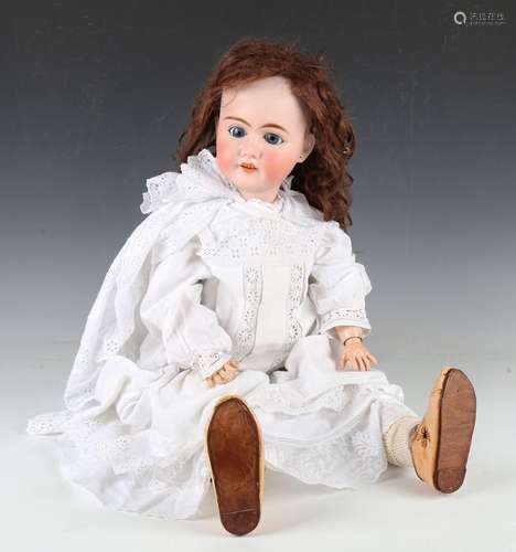 A Pierre Muller Olympia bisque head doll with brown wig