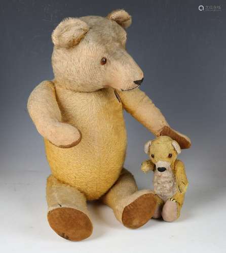 A mid-20th century mohair teddy bear with amber and black ey...