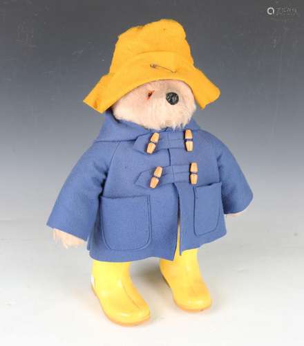 A Gabrielle Designs Ltd Paddington Bear wearing a yellow fel...