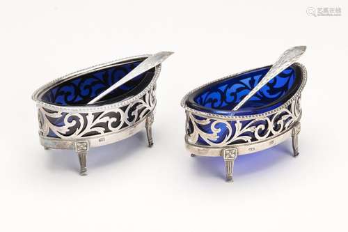 A pair of Dutch silver salt cellars with blue glass and matc...