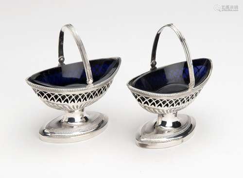 A pair of Dutch silver salt cellars with swing handle, Kingd...