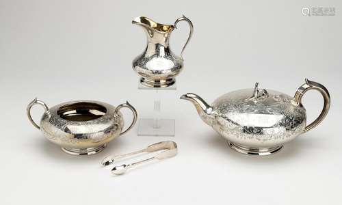 A three-piece English silver and gilt tea service