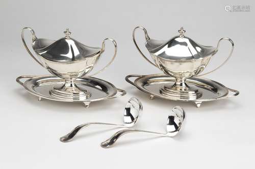 A pair of English silver sauce boats with cover on tray