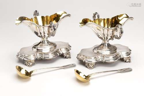 A pair of French silver and gilt saucieres on stand with two...