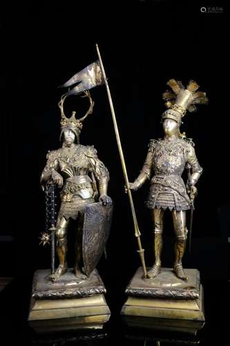 A pair of silver gilt statues of knights