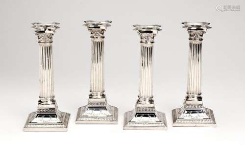 Four Dutch silver column candlesticks