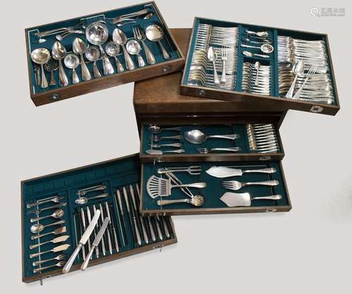 A wooden canteen with a collection of Dutch silver flatware