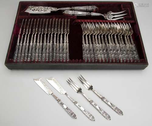 Twelve French silver fish forks and knives with serving fork...