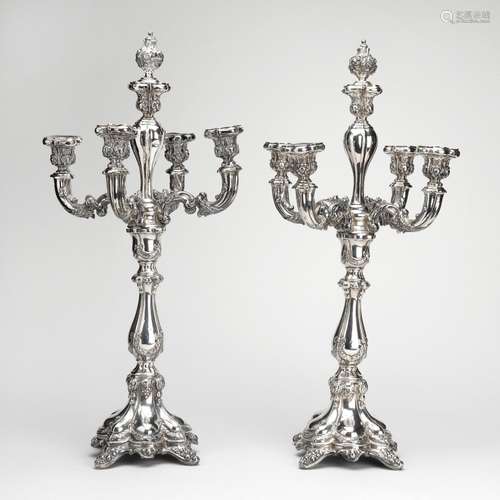 A pair of Russian silver five light candelabra