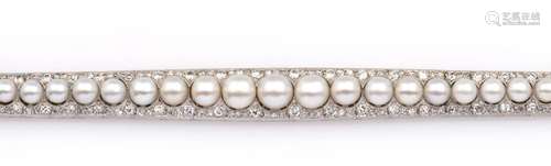 A pearl and diamond bracelet