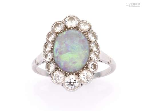 A platinum opal and diamond ring