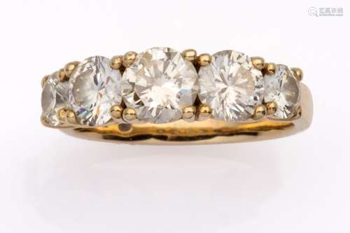 An 18k gold diamond five stone ring