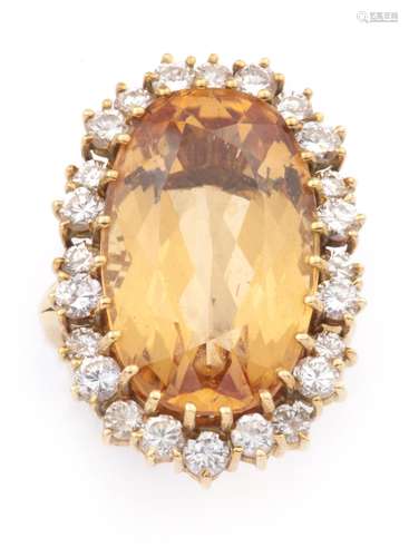 An 18k gold citrine and diamond cocktail ring