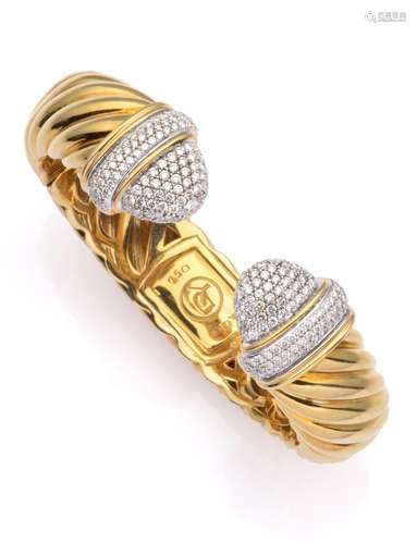 An 18k gold diamond bangle