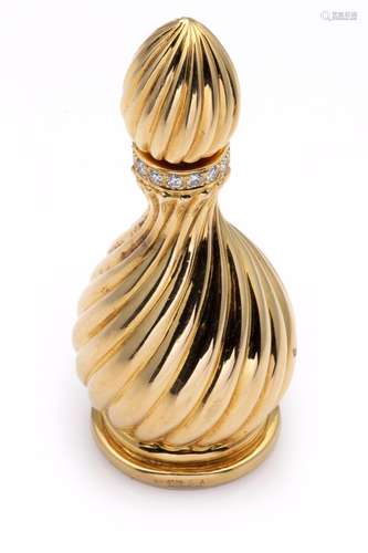 An 18k gold diamond-set perfume bottle