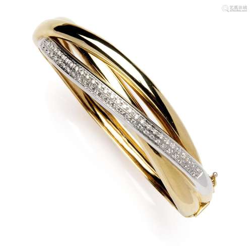 An 18k two colour gold diamond bangle