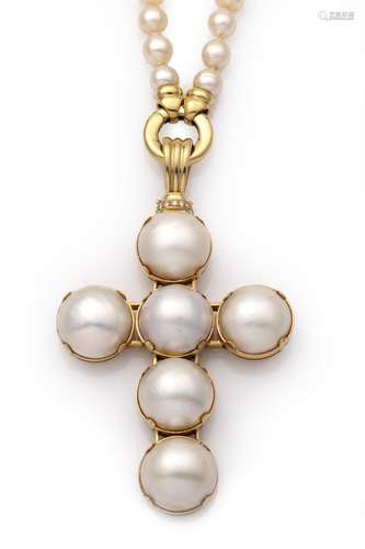 An 18k gold Mabé pearl pendant on a cultured pearl necklace