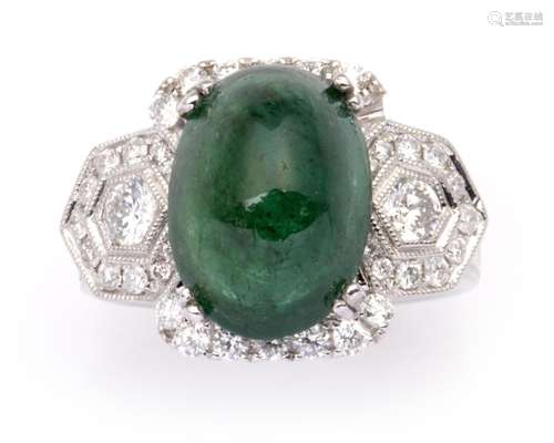 A 14k gold emerald and diamond ring