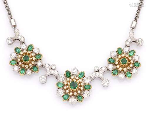 A 14k white gold emerald and diamond necklace