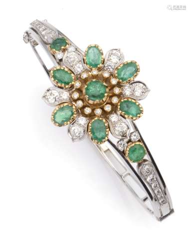 A 14k white gold emerald and diamond bangle