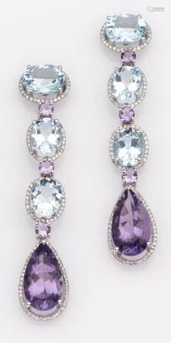 An 18k white gold pair of topaz and amethyst earrings