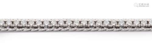 An 18k white gold diamond line bracelet