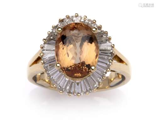 An 18k gold topaz and diamond ring